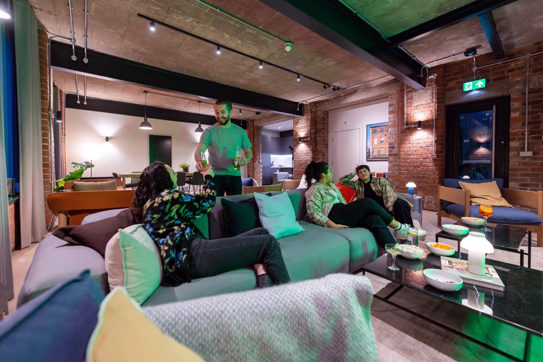 Homemates relaxing in communal lounge. 