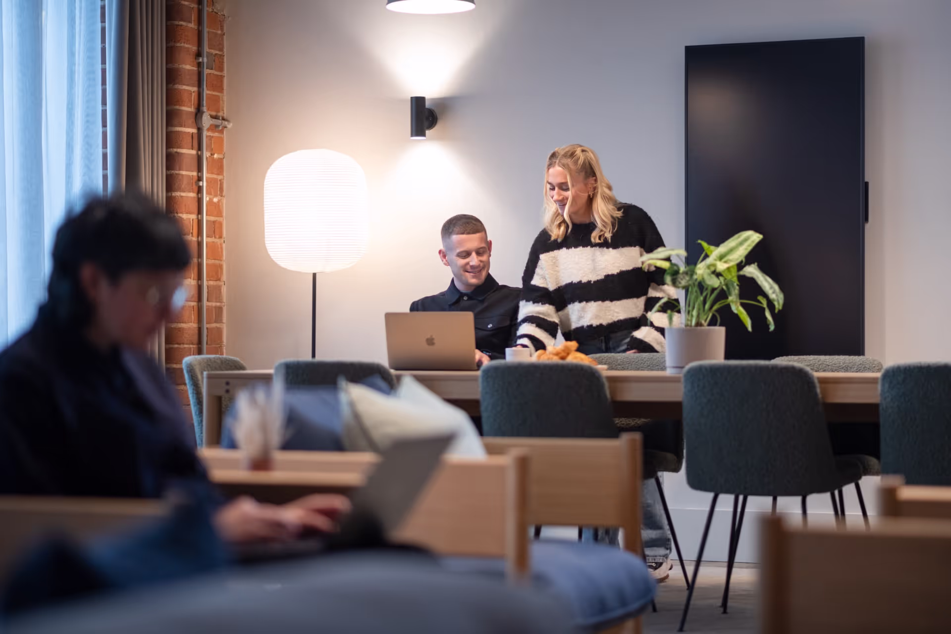 A communal workplace at OllO Living.