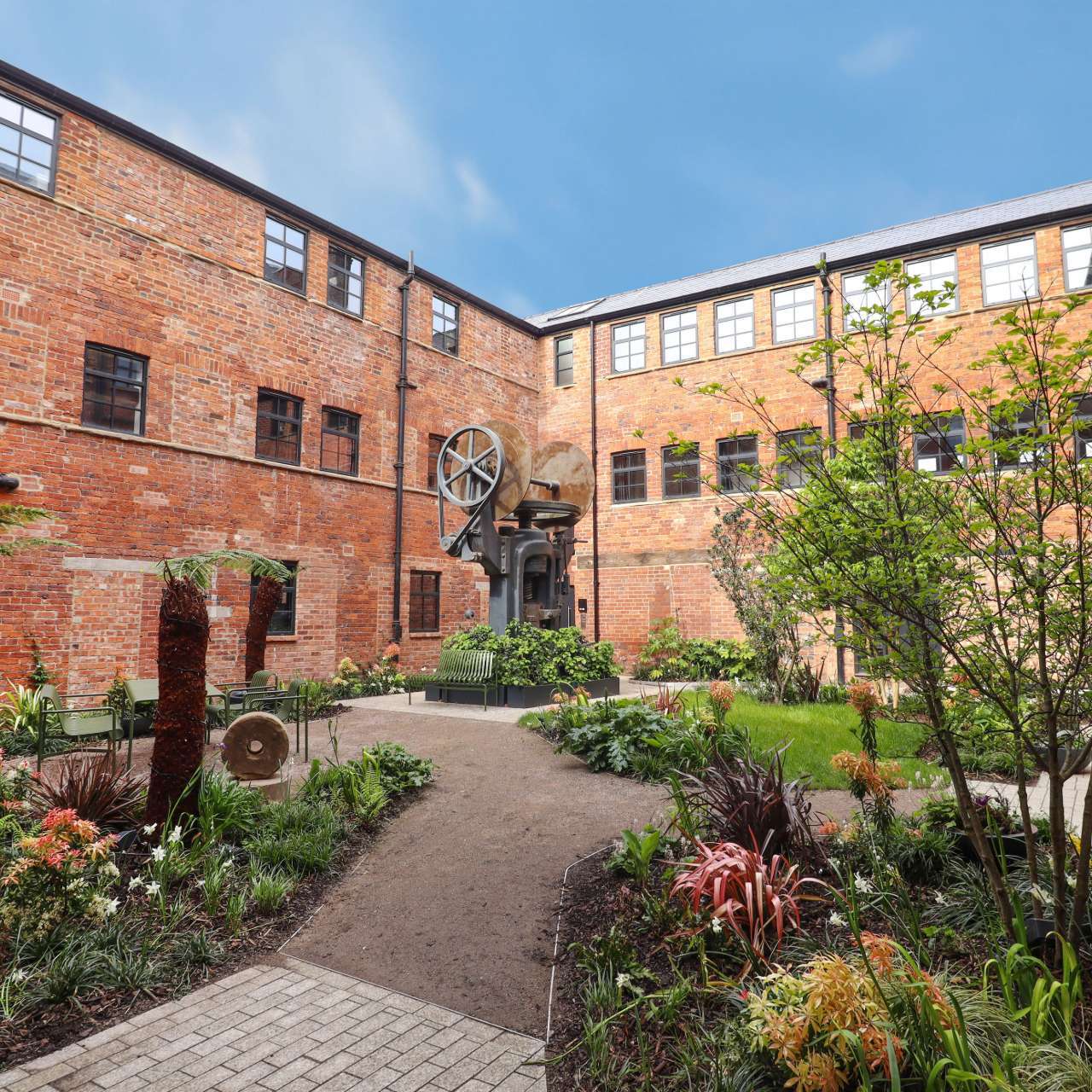 Stone building with courtyard and bright blue sky