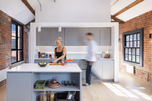 Couple cooking in modern open kitchen